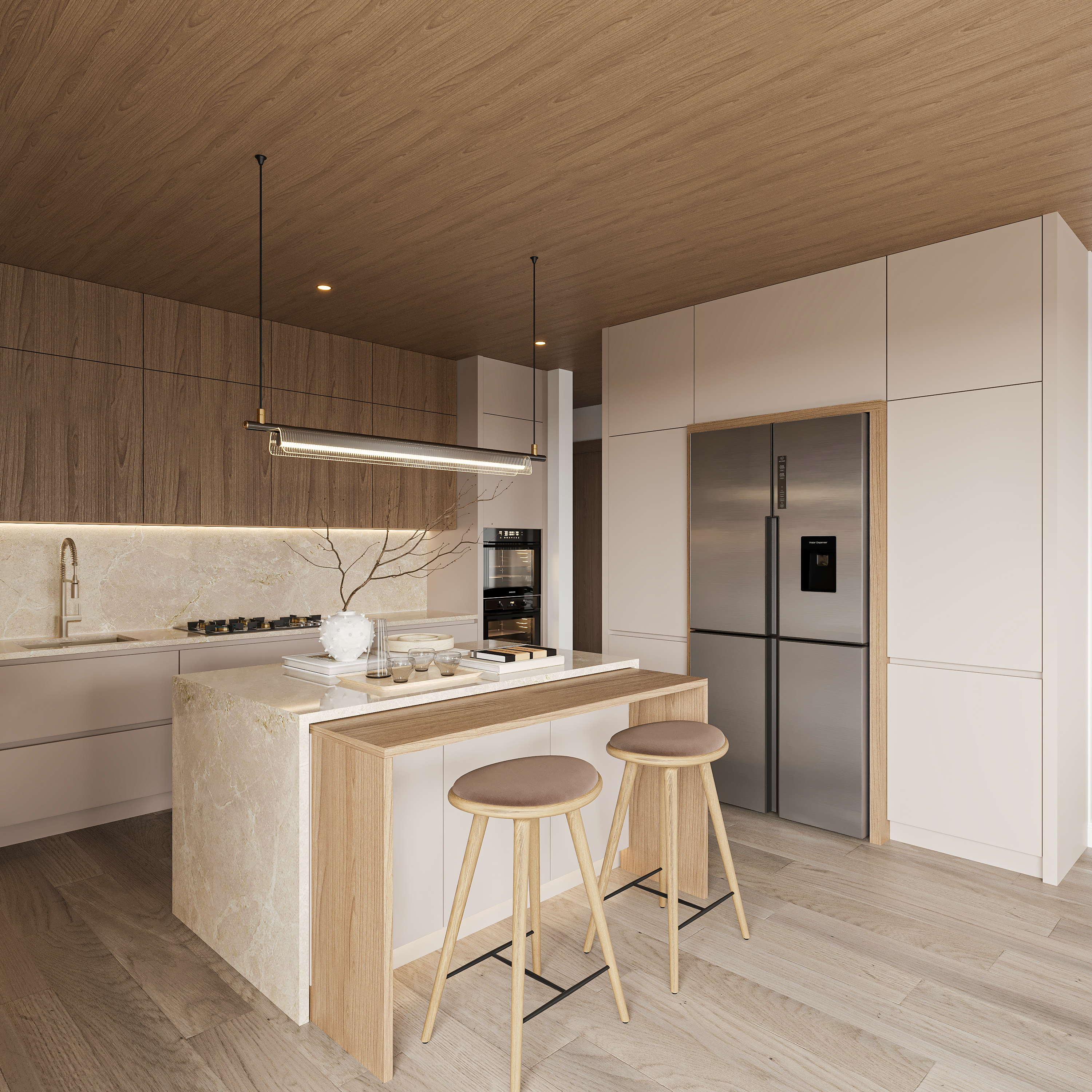 Kitchen with a stone waterfall island and oak breakfast ledge with two stools, walnut and cream tall joinery concealing a stainless refrigerator and a warm timber-lined ceiling