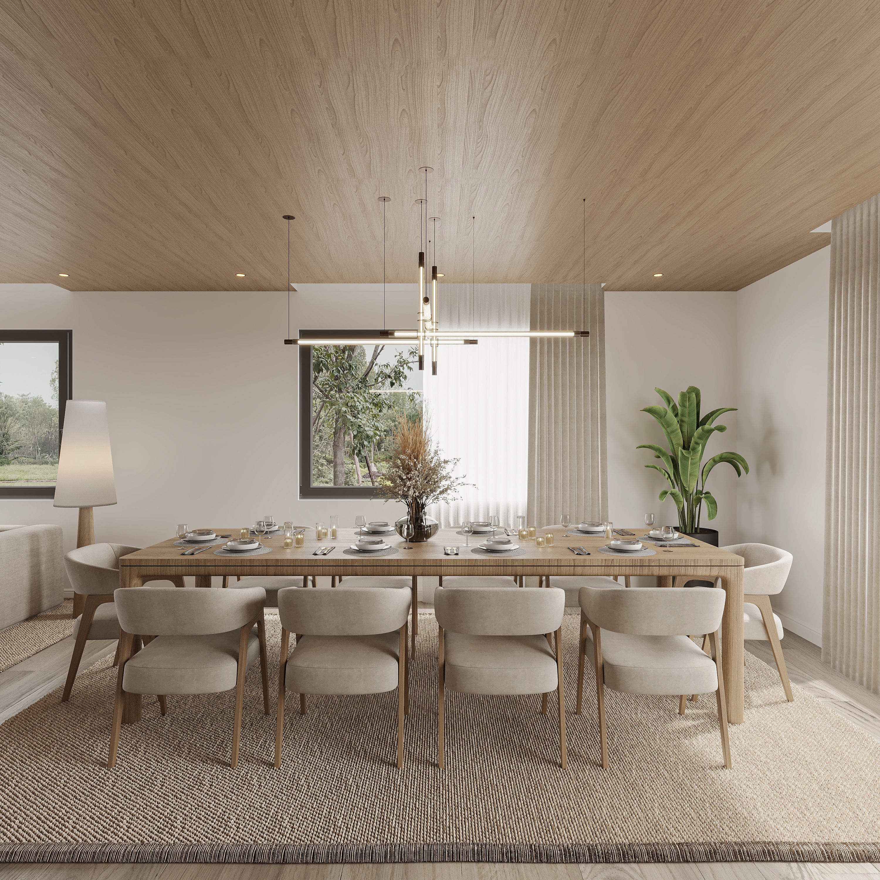Dining room under a warm oak ceiling with a long reeded timber table, cream upholstered armchairs, layered linear pendant bars, a woven rug and sheer curtains at black-framed windows