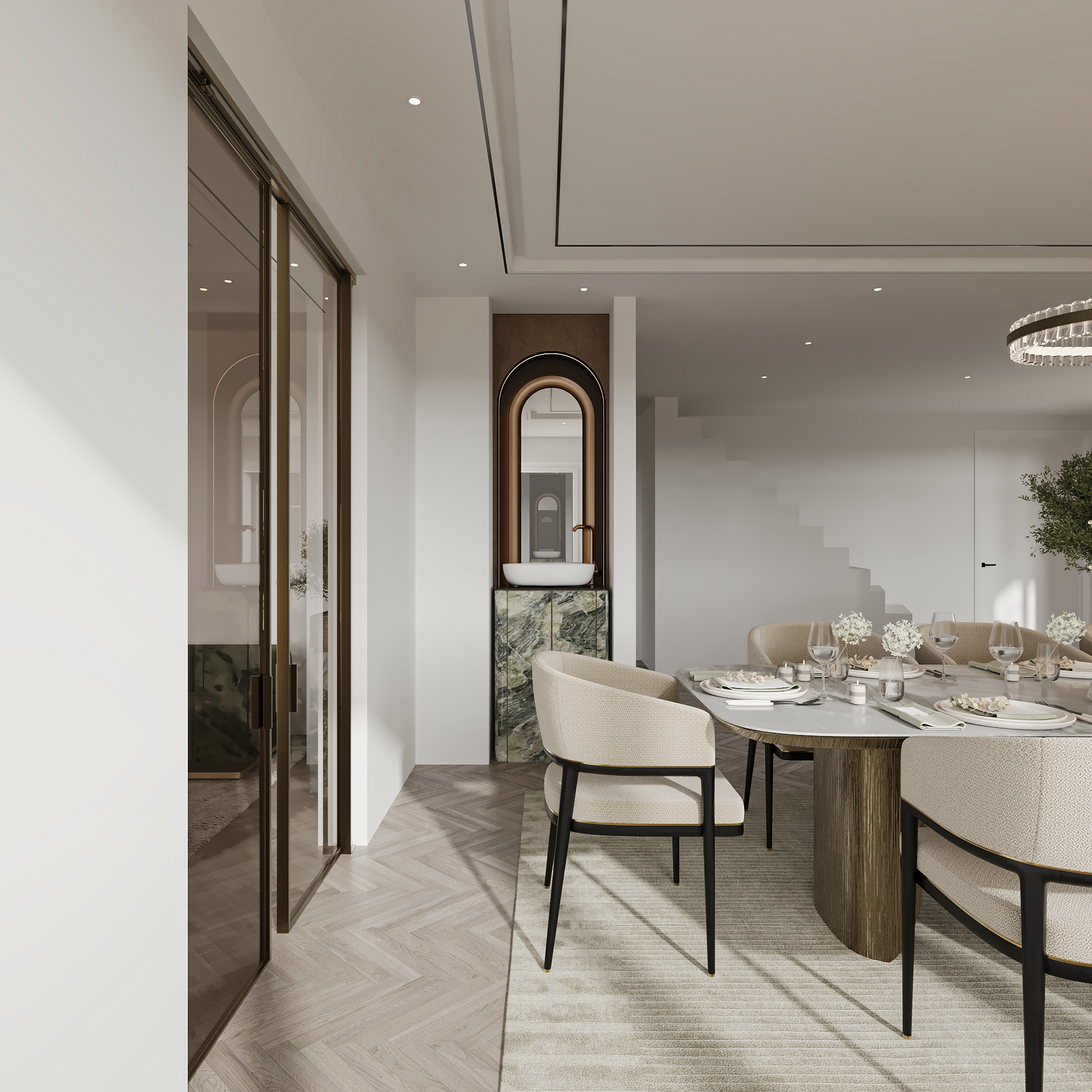 Passage to the dining room with bronze-framed glazed doors, an arched niche with a green marble console and stone basin, herringbone flooring and bouclé dining chairs beyond