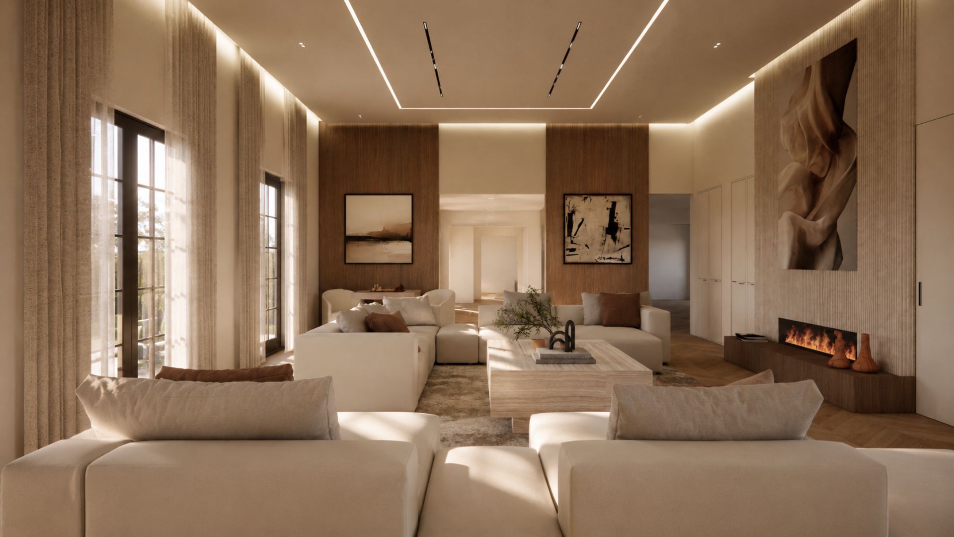 Long living room view in warm light with timber-panelled walls, framed abstract artworks, a linear fireplace under a sculptural relief, ivory modular seating and sheer curtains at black-framed glazing