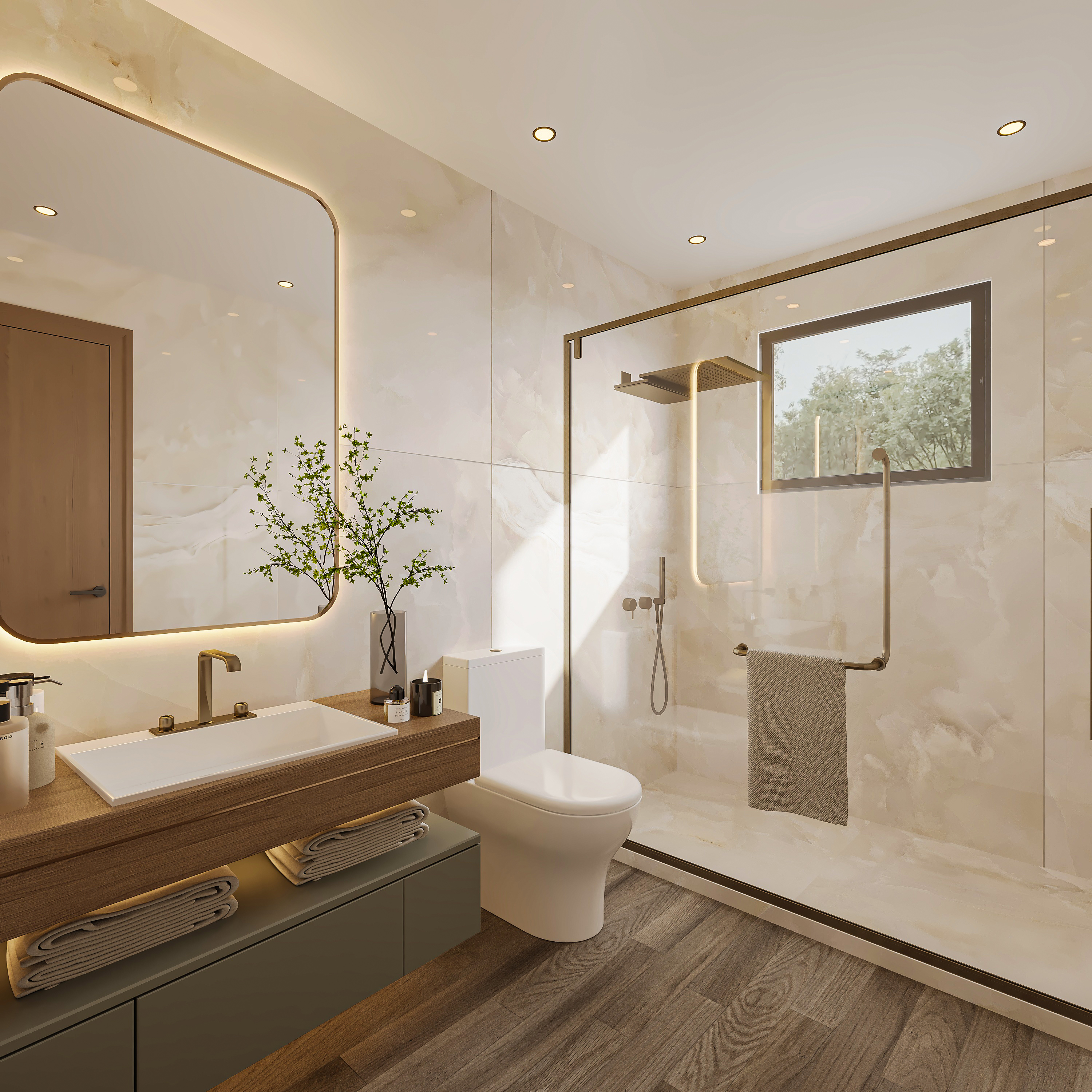Bathroom in pale onyx stone with a walnut-topped vanity over a sage cabinet, backlit brass-framed mirror, and a walk-in shower behind glass with a small window onto trees