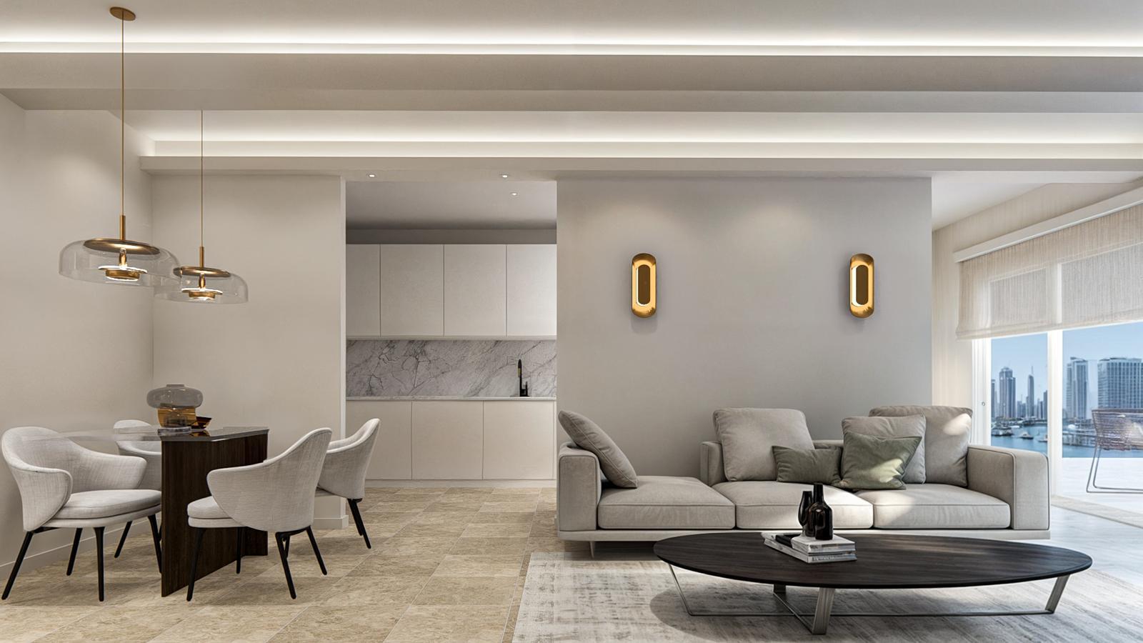 Open living and dining space with a dark walnut dining table and ivory chairs beneath twin smoked glass pendants, the white kitchen with marble backsplash beyond, brass sconces and a linen sofa facing the waterfront glazing