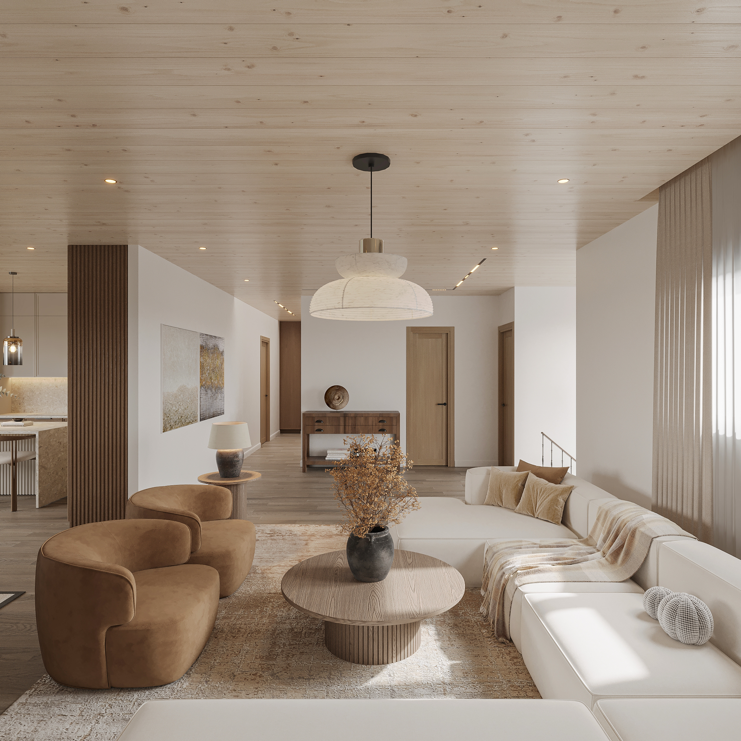 Living room with paired tan suede swivel chairs, an ivory sectional, round fluted oak coffee table, reeded timber column, framed landscape canvas and an oversized fabric pendant