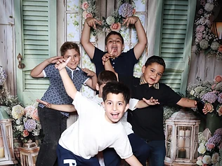 Five boys celebrating at a GlamBooth garden-themed birthday