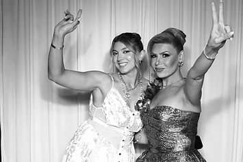 Two women celebrating at a GlamBooth wedding
