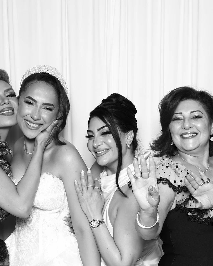Bride celebrating with guests in the GlamBooth wedding photo booth
