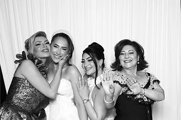 Bride celebrating with guests in the GlamBooth wedding photo booth