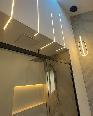 Hallway with concealed linear lighting and skylight