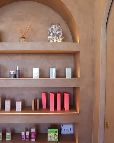 Arched display shelving with concealed strip lighting