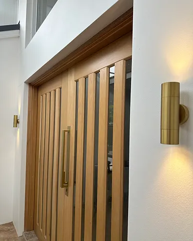 Timber slat wall with brass wall light