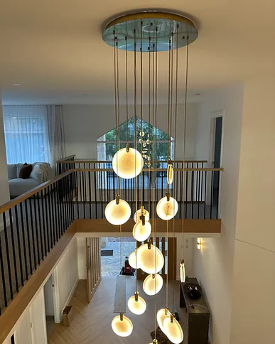 Pendant light cluster in a double-height stairwell