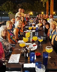 The crew gathered around the table at the post shred dinner party