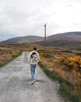 Nathan walking a rural gravel path in County Kerry