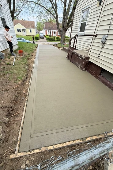New concrete walkway with decorative border
