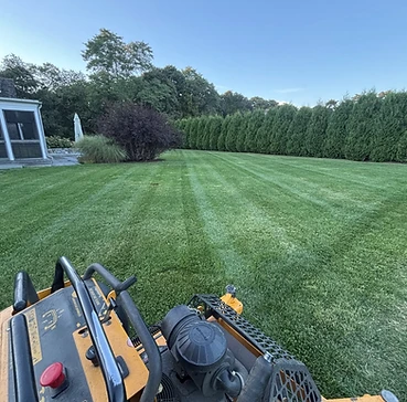 Commercial zero-turn mower maintaining a residential lawn