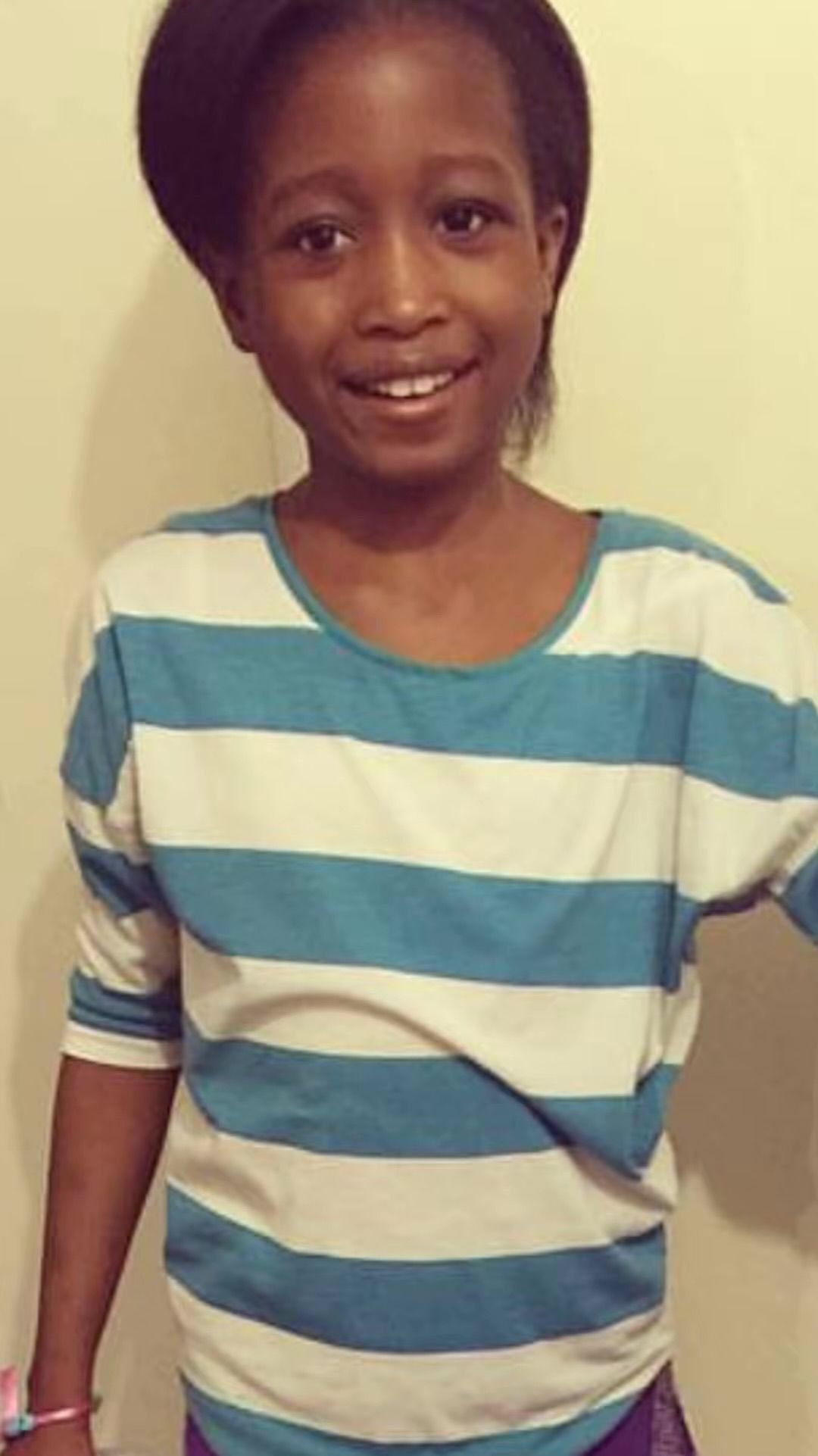 Elizabeth smiling in a striped shirt