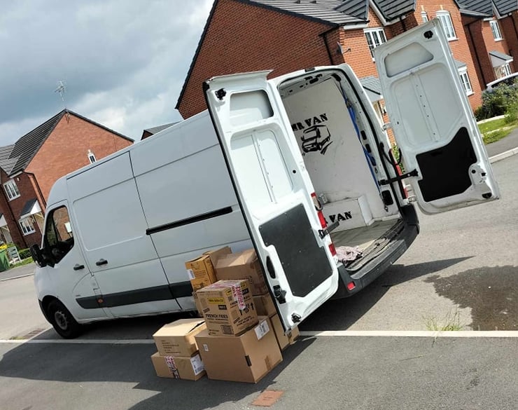 White MR VAN Removals and Clearance company van loaded with moving boxes and household items