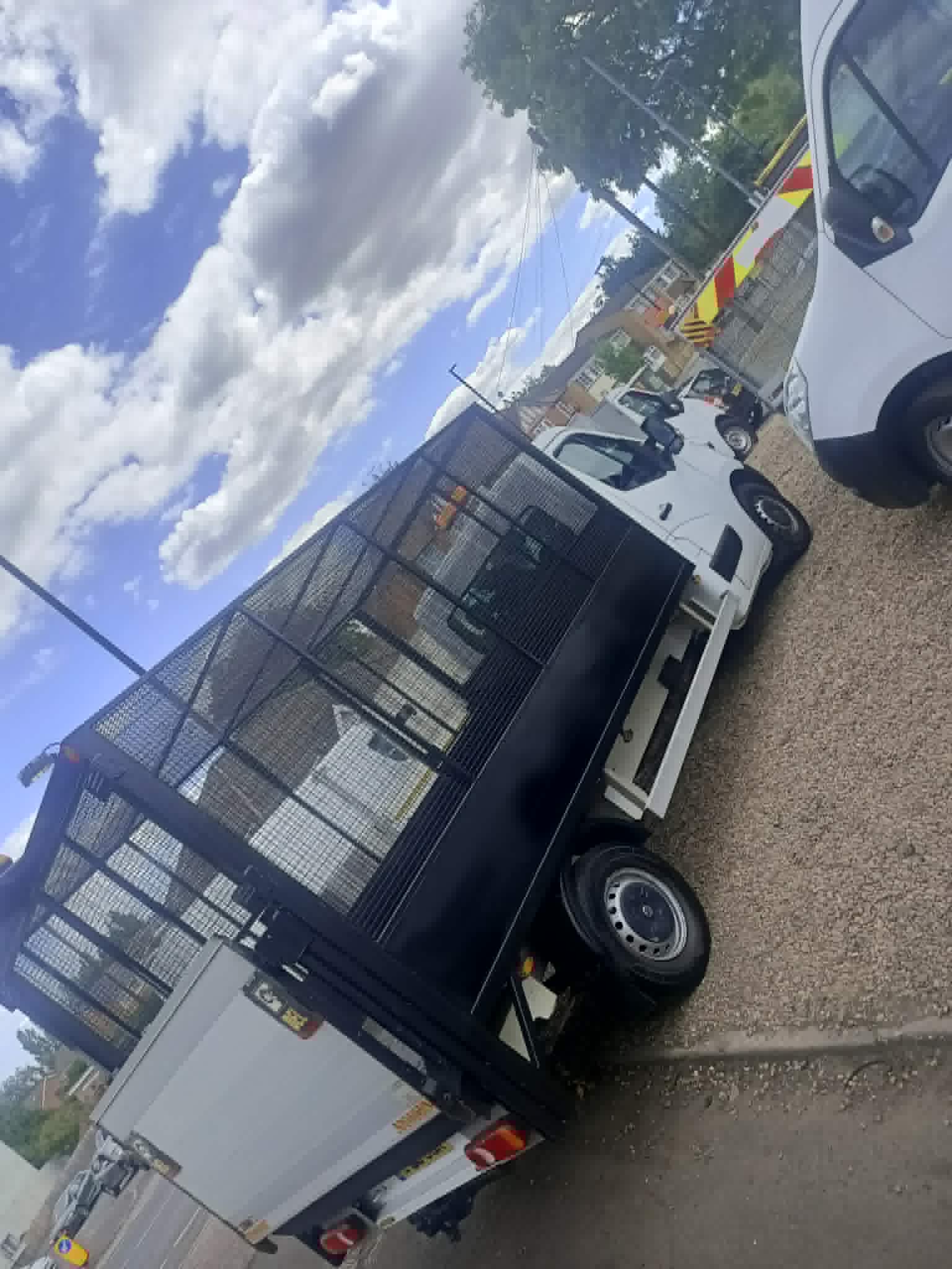 MR VAN Removals and Clearance cage back truck ready for a waste collection