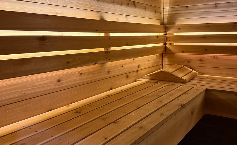 Cedar sauna bench with warm recessed light