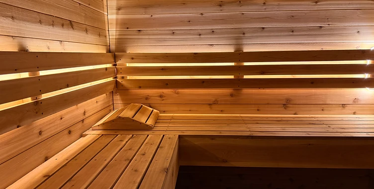 Cedar sauna interior with warm concealed lighting