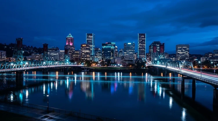 Portland Oregon skyline at twilight with cyan light trails on the Willamette River