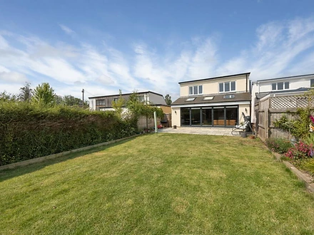 Rear elevation with black-framed bifold doors onto the patio