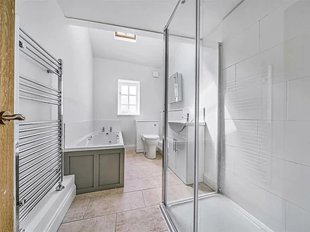 Bathroom with shower and skylight