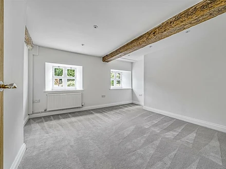 Bedroom with exposed timber beam