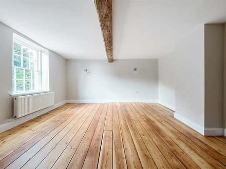 Bedroom with exposed timber floor