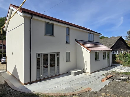 Side and rear view of the rendered two-storey self-build