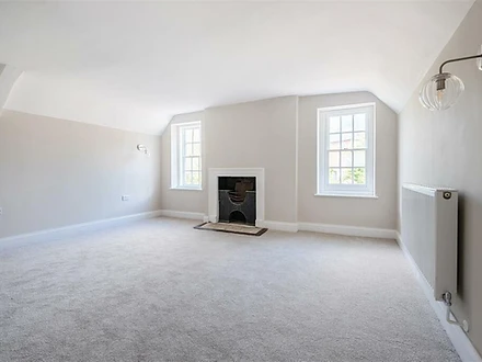 Bedroom with fireplace and sash windows