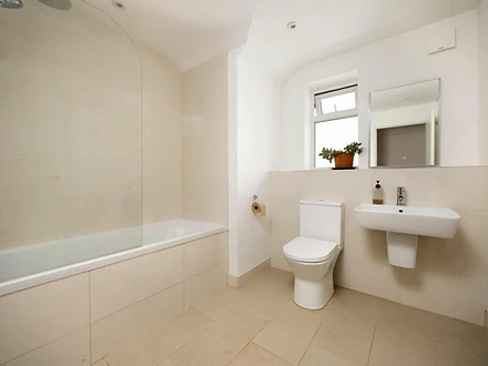 Family bathroom with bath, shower screen and LED mirror