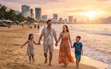 A happy family walking along the sandy shores of My Khe Beach in Da Nang during sunset.