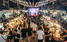 Helio Night Market Da Nang at night with illuminated food stalls and LED lights