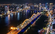 Things to do in Da Nang showing Dragon Bridge over Han River at night