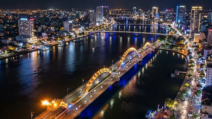 Things to do in Da Nang showing Dragon Bridge over Han River at night