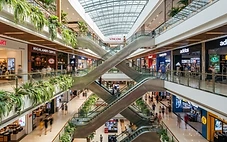 Interior of a modern da nang mall with retail stores and open atrium