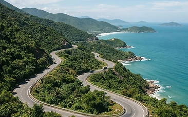 Scenic coastal road winding through green hills on a solo day trip from Da Nang