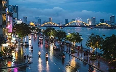 Da Nang skyline reflected in wet streets on a rainy November evening