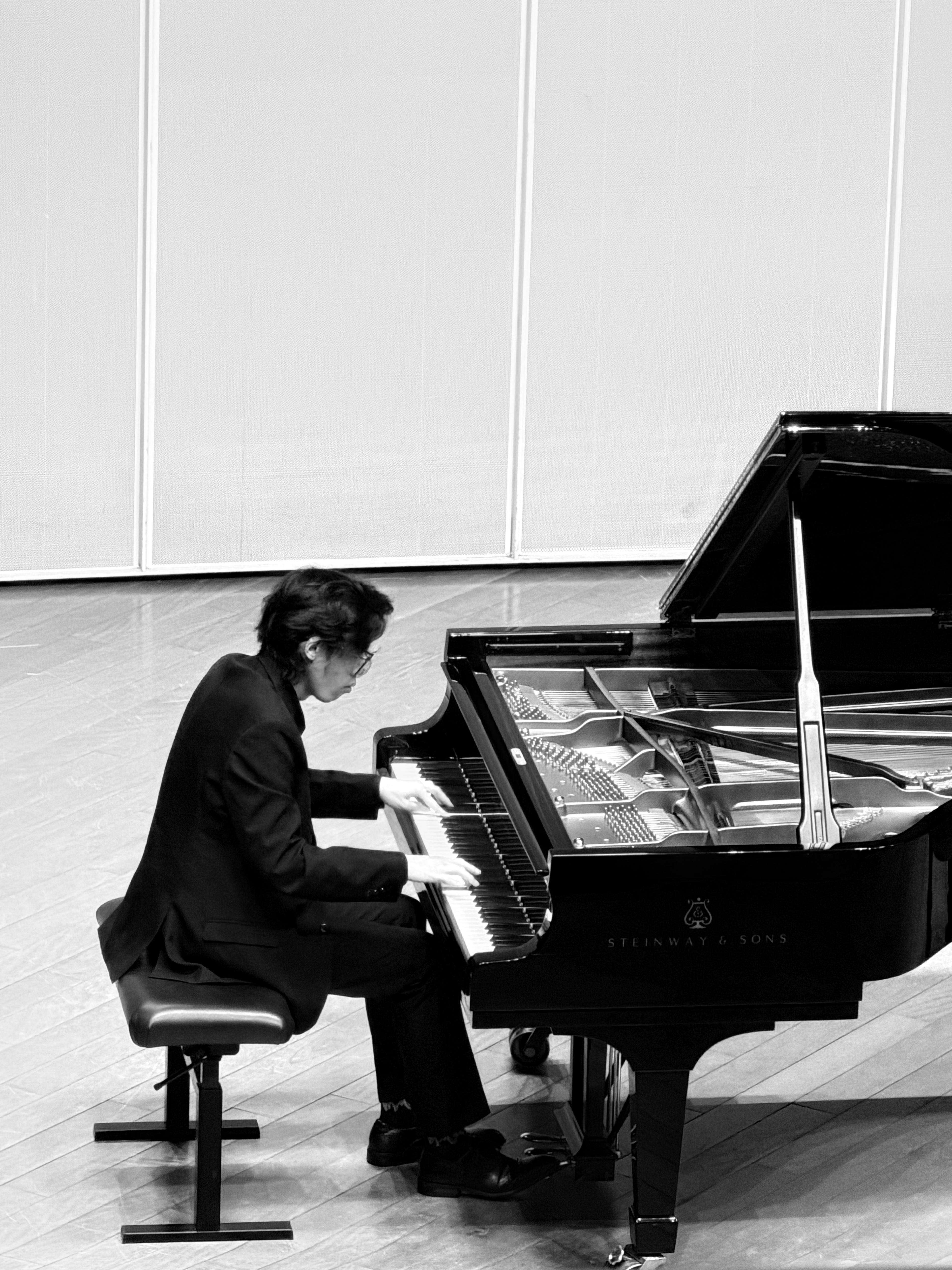 Ho Yu-To performing at a Steinway grand piano