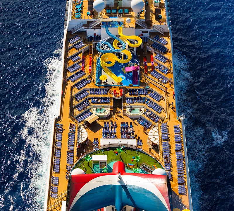 Aerial top-down view of the Carnival Sunrise cruise ship sailing through deep blue ocean
