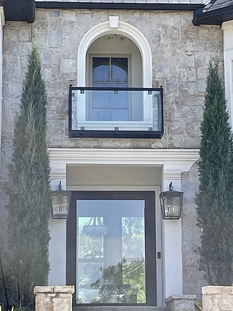 Modern balcony guard with glass panels and minimal metal frame