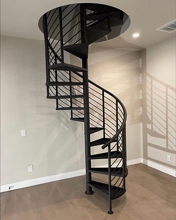Contemporary black spiral staircase with continuous curved handrail