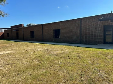 Ackerman Elementary Addition exterior brick facade with windows and entrance awning