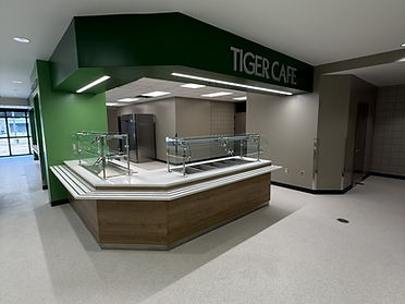 Tiger Cafe serving line at McLaurin Elementary with green bulkhead signage