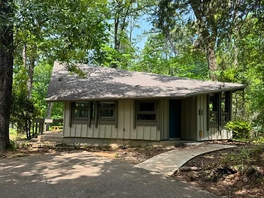 Clarkco State Park cabin exterior with vertical board-and-batten siding in the woods