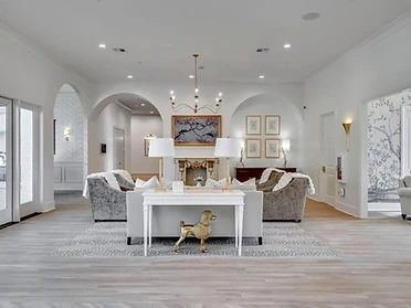 Great room with fireplace and arched alcoves