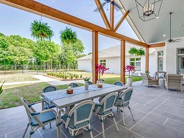 Covered patio furnished with dining and lounge seating