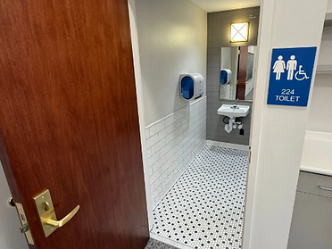 Accessible restroom entrance with ADA-compliant signage at Hinds County Courthouse