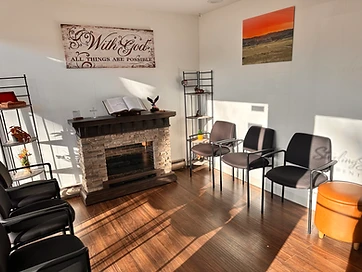 Sterling Smiles Dental waiting area with stone fireplace and seating